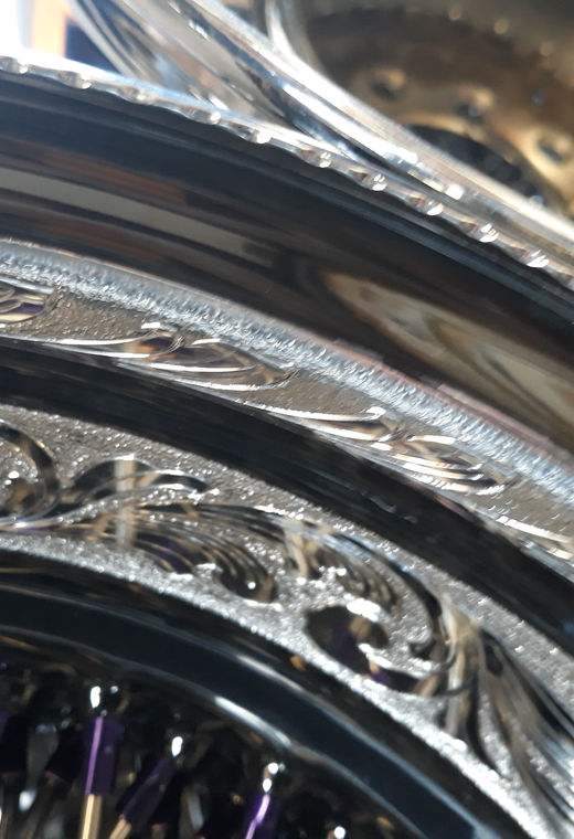 Engraved wire wheel finish